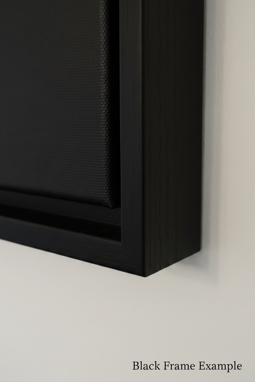 Close-up of a black frame corner mounted against a light gray wall, with the text 'Black Frame Example' at the bottom right.