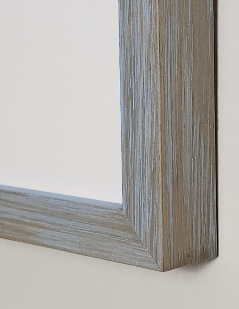 Close-up of a wooden picture frame on a white background