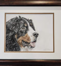 Framed artwork of a dog's portrait on a white background
