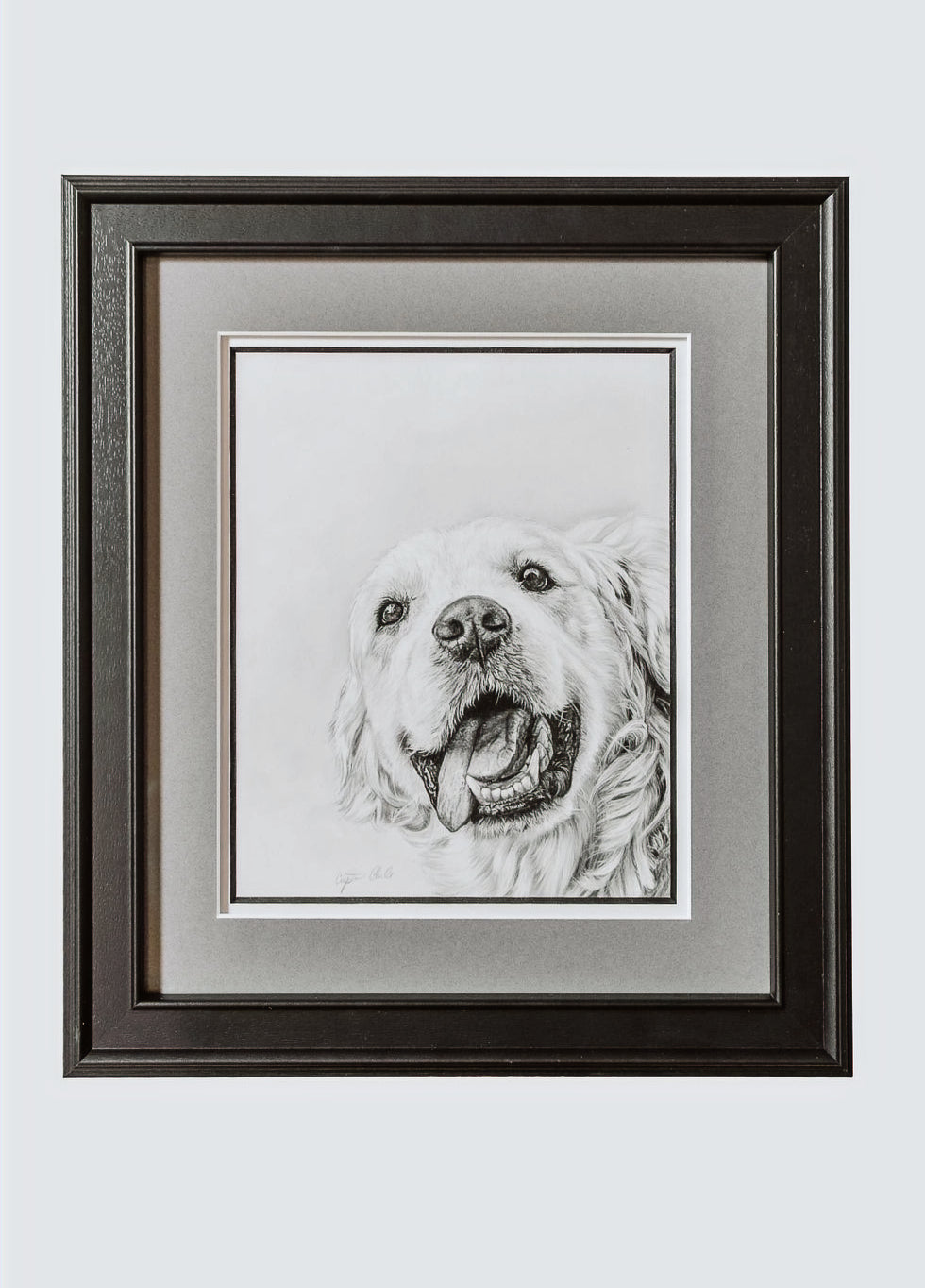 Framed black and white portrait of a dog on a light gray background