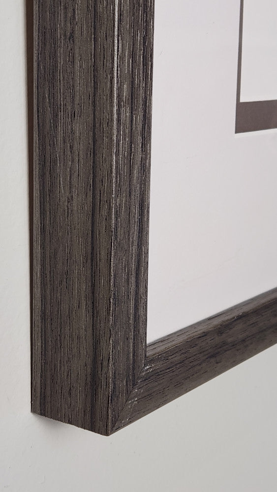 Close-up of a wooden picture frame on a white background