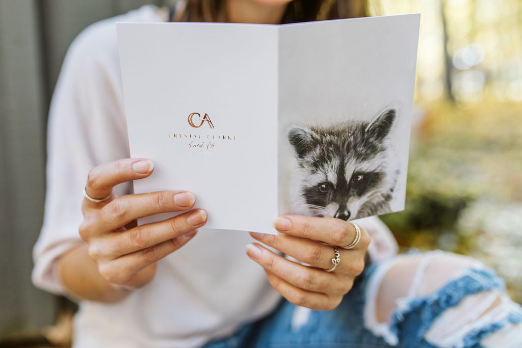 Crystal Clarke Animal Art greeting card with logo