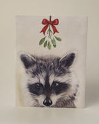 Racoon drawing with mistletoe above 