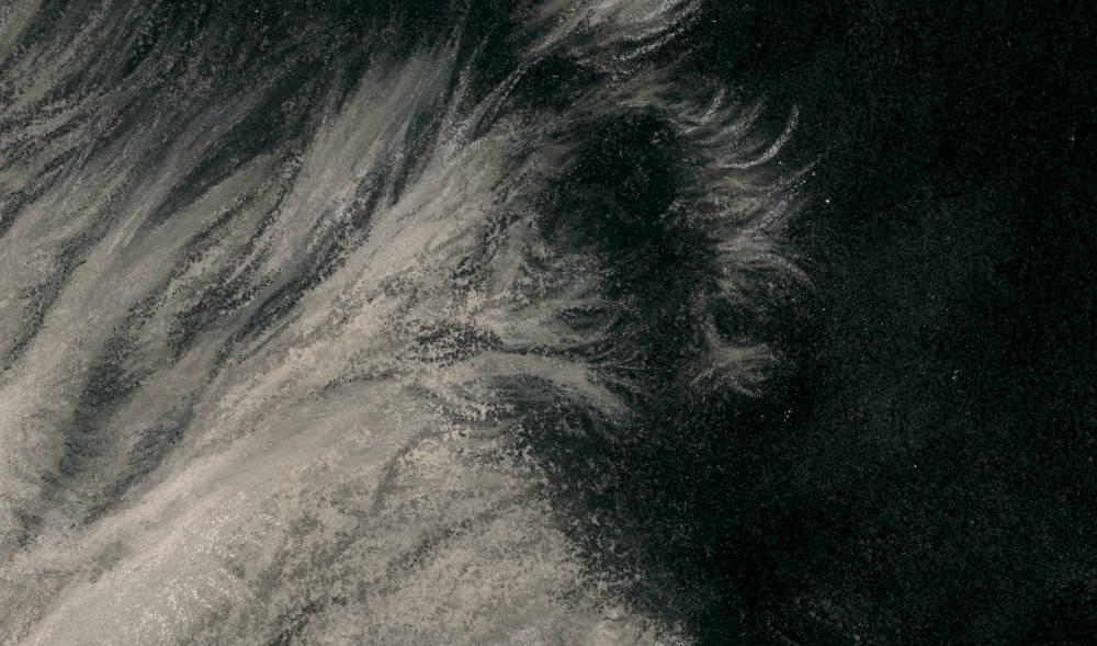 Close-up of a textured surface of horse artwork